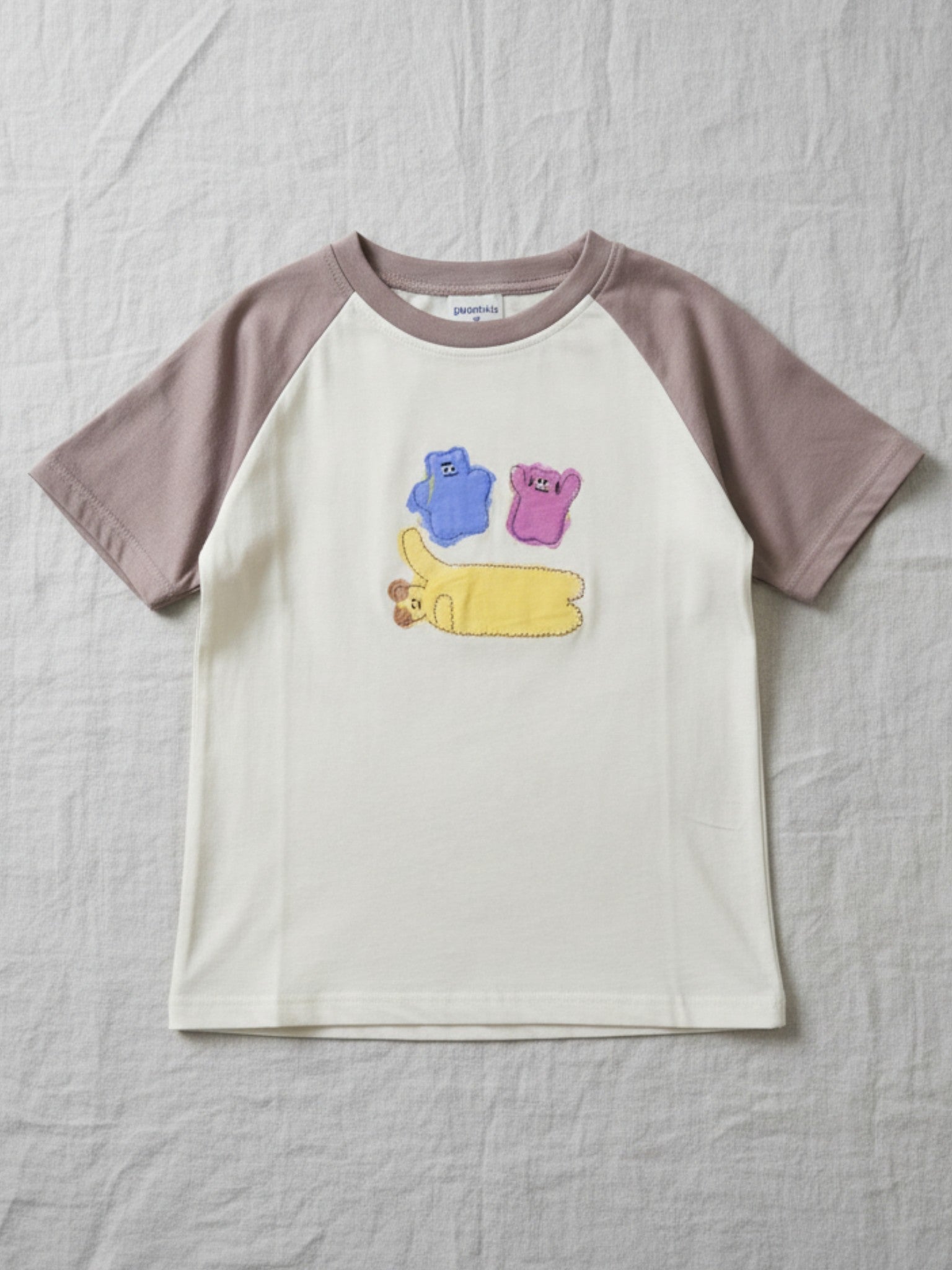 Half Moon Clothing kids' white short-sleeve t-shirt with a textured black abstract graphic, premium breathable fabric for all-day comfort."