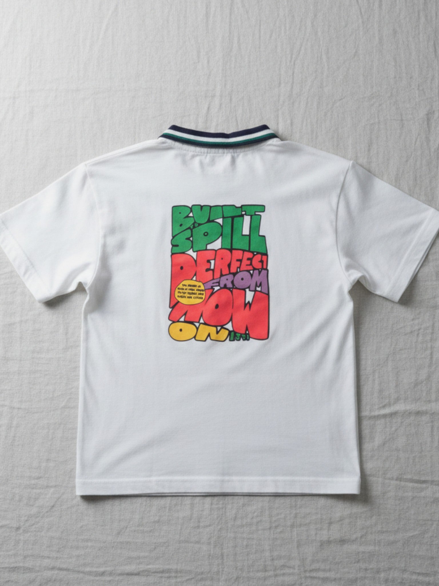 A high-quality kids' cotton polo with a modern streetwear-inspired graphic, designed for durable play and polished, everyday style.