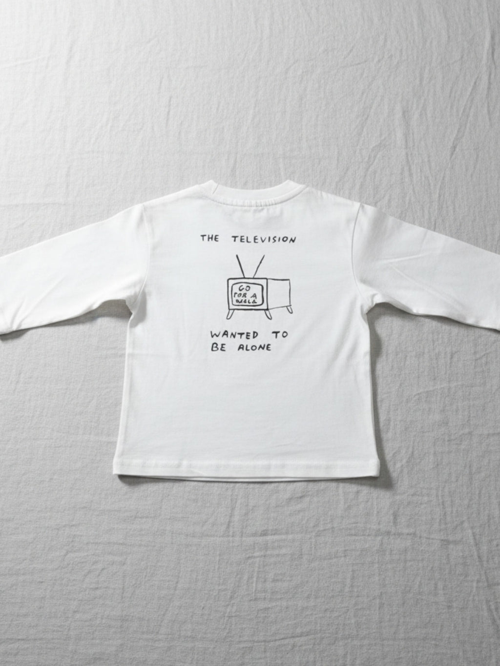 A high-quality, breathable kids' white cotton top with a unique minimalist graphic, designed for a modern look and comfortable, long-lasting daily wear.