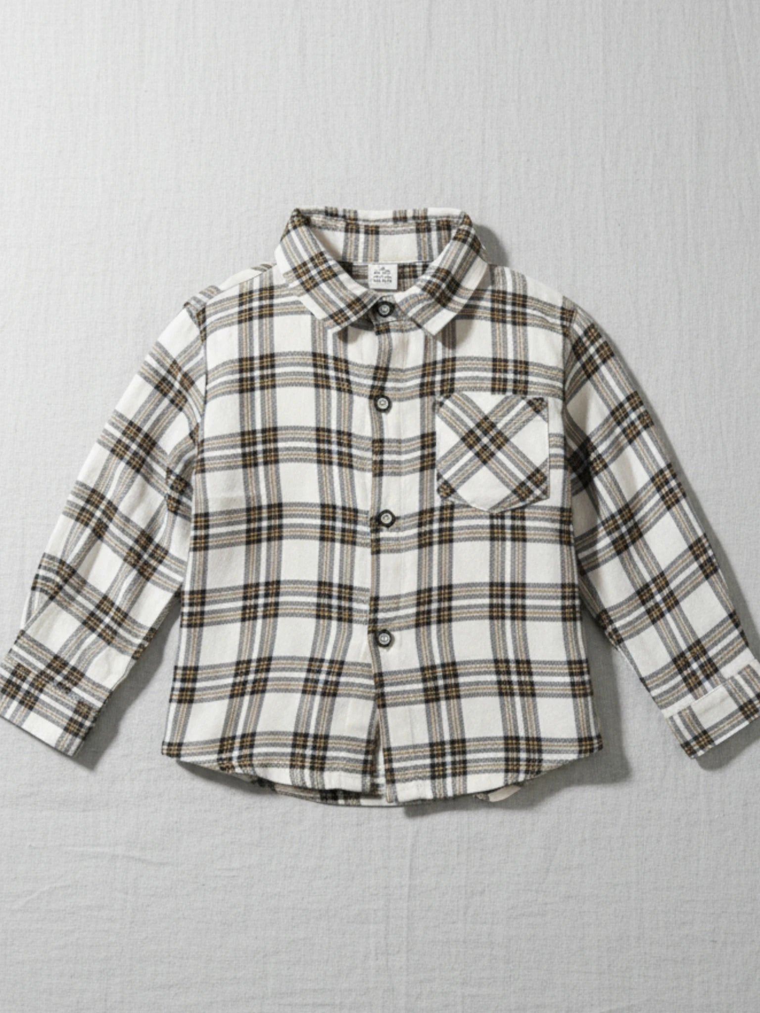 Kids cream and brown plaid long sleeve flannel button-down shirt with a chest pocket 