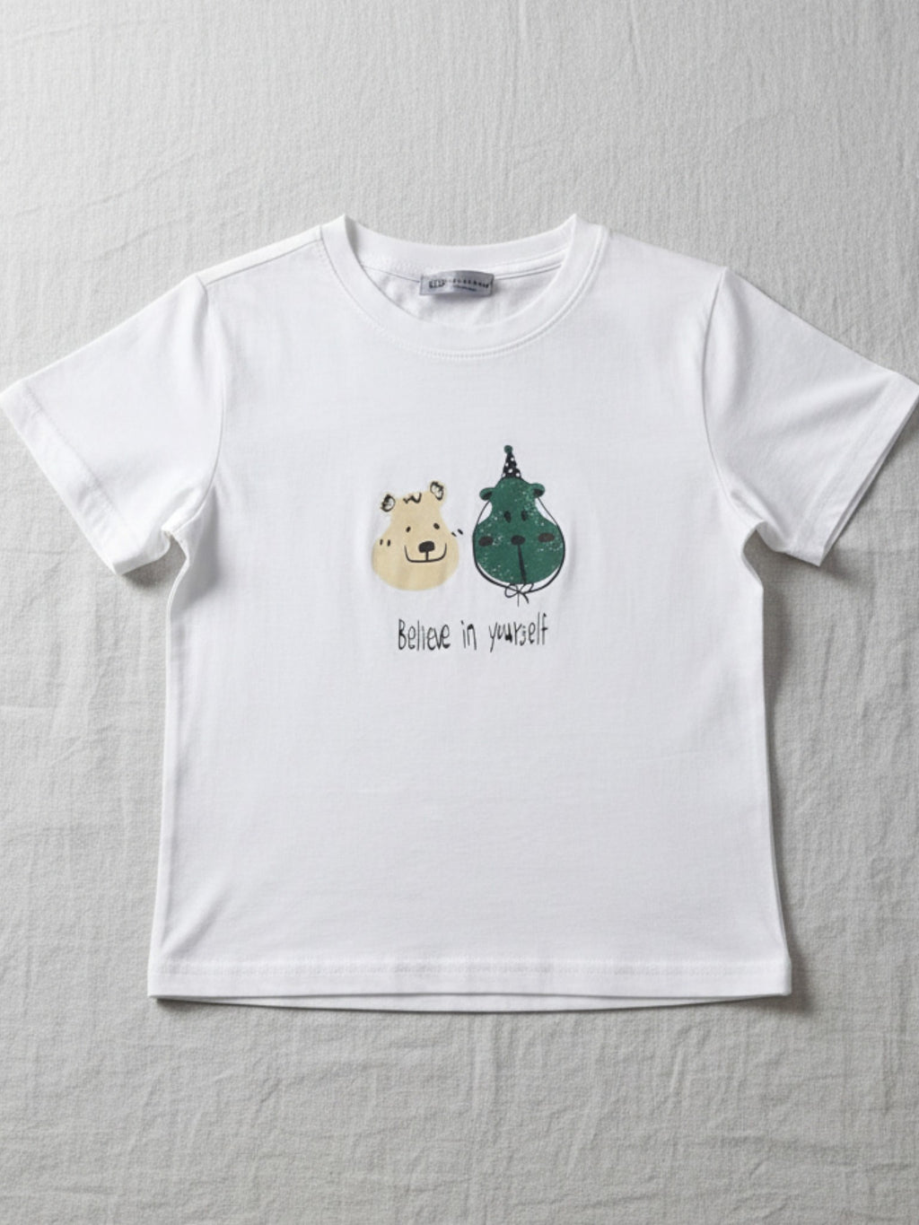 kids cute. White t-shirt with cartoon bear and dragon design on a gray background