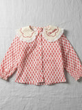 Girls' long-sleeve blouse featuring a red floral blossom print and a white embroidered scalloped collar with lace trim.