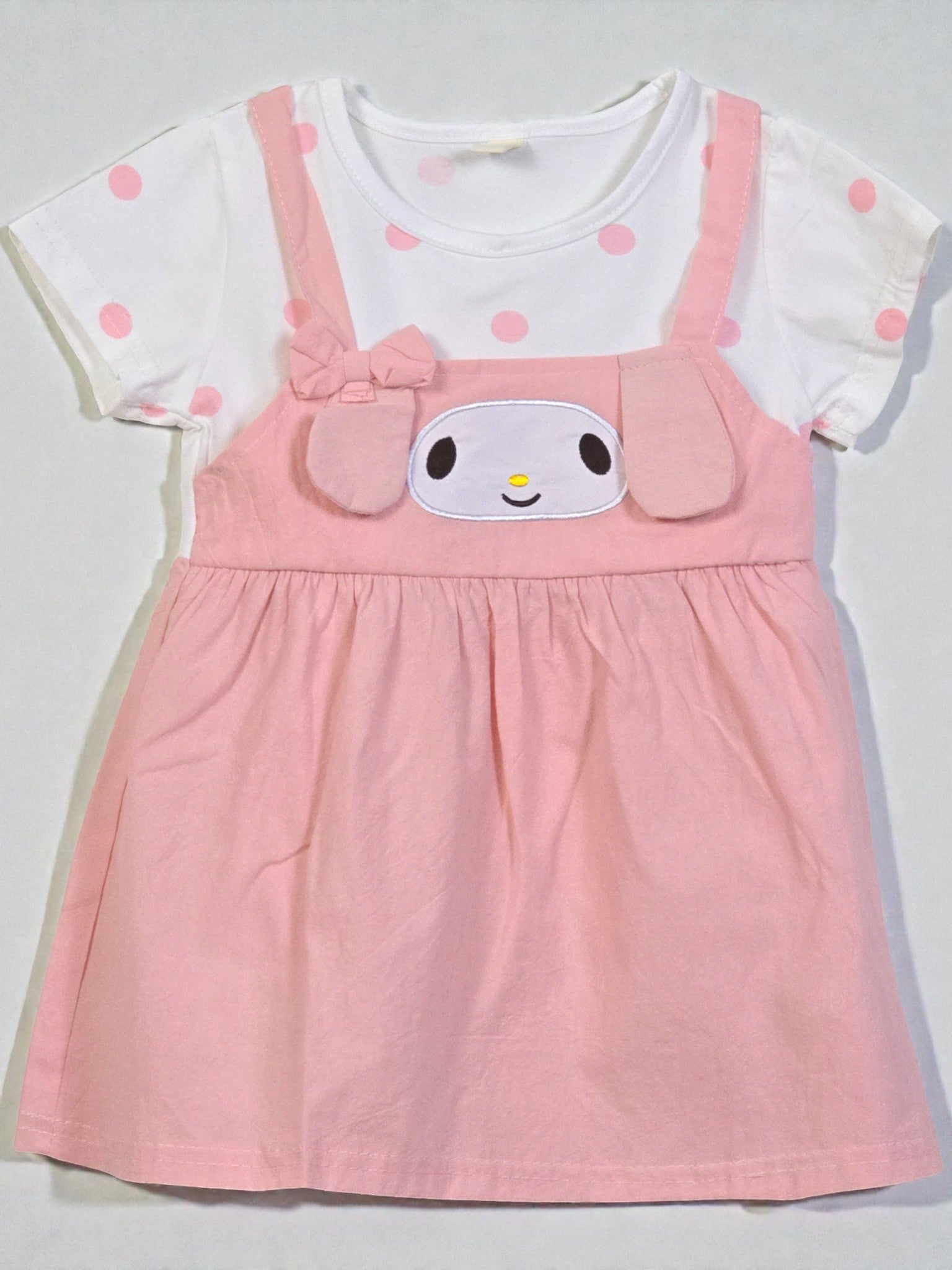 Pink dress with cartoon face design on a white background. Pink 6