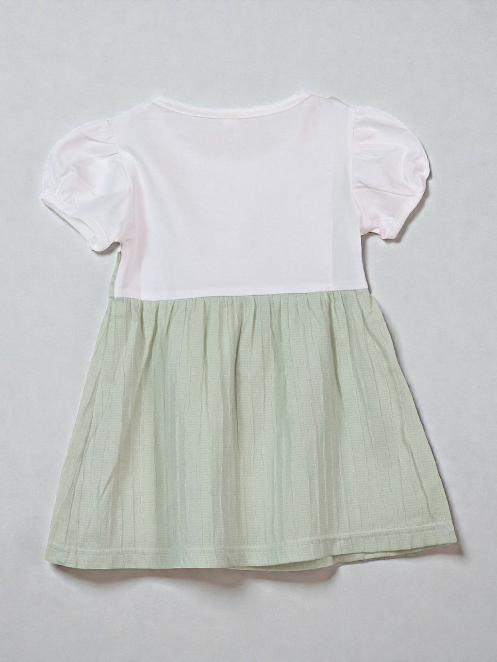 Two-tone dress with white top and green skirt. Sage