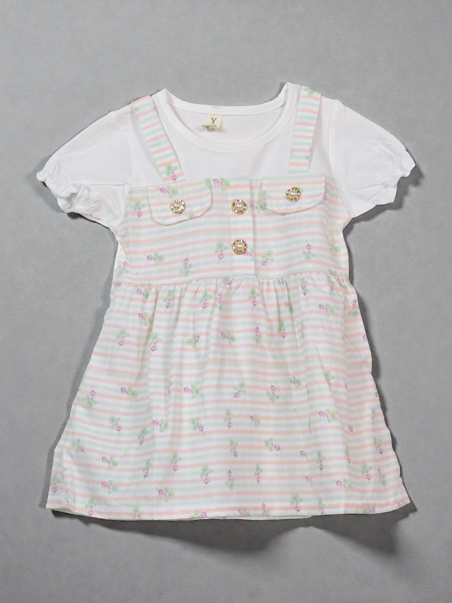 White dress with floral pattern on a gray background. Floral