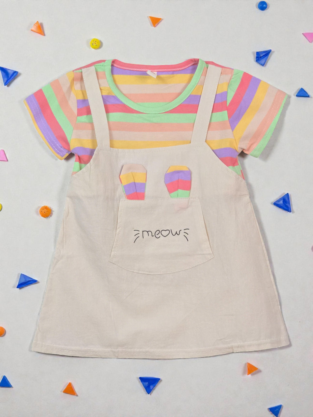 Colorful striped shirt with a beige apron on a light gray background with colorful confetti. Rainbow