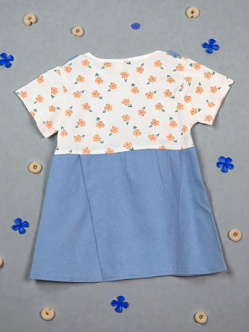 Blue pinafore dress with floral top on a light gray background Dark blue