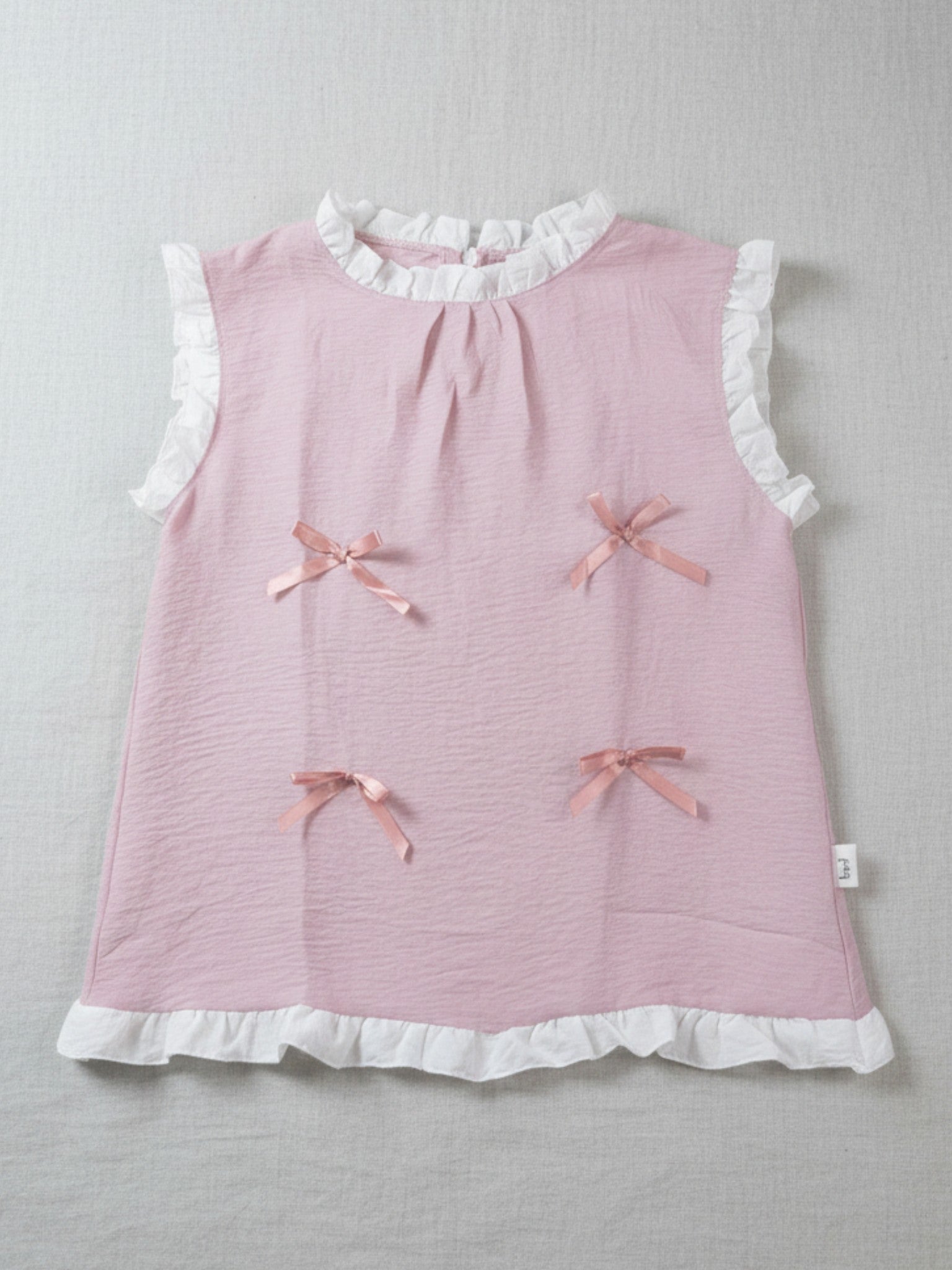 kids, girls comfortable Pink top/blouse with white ruffled collar and hem, and pink bows
