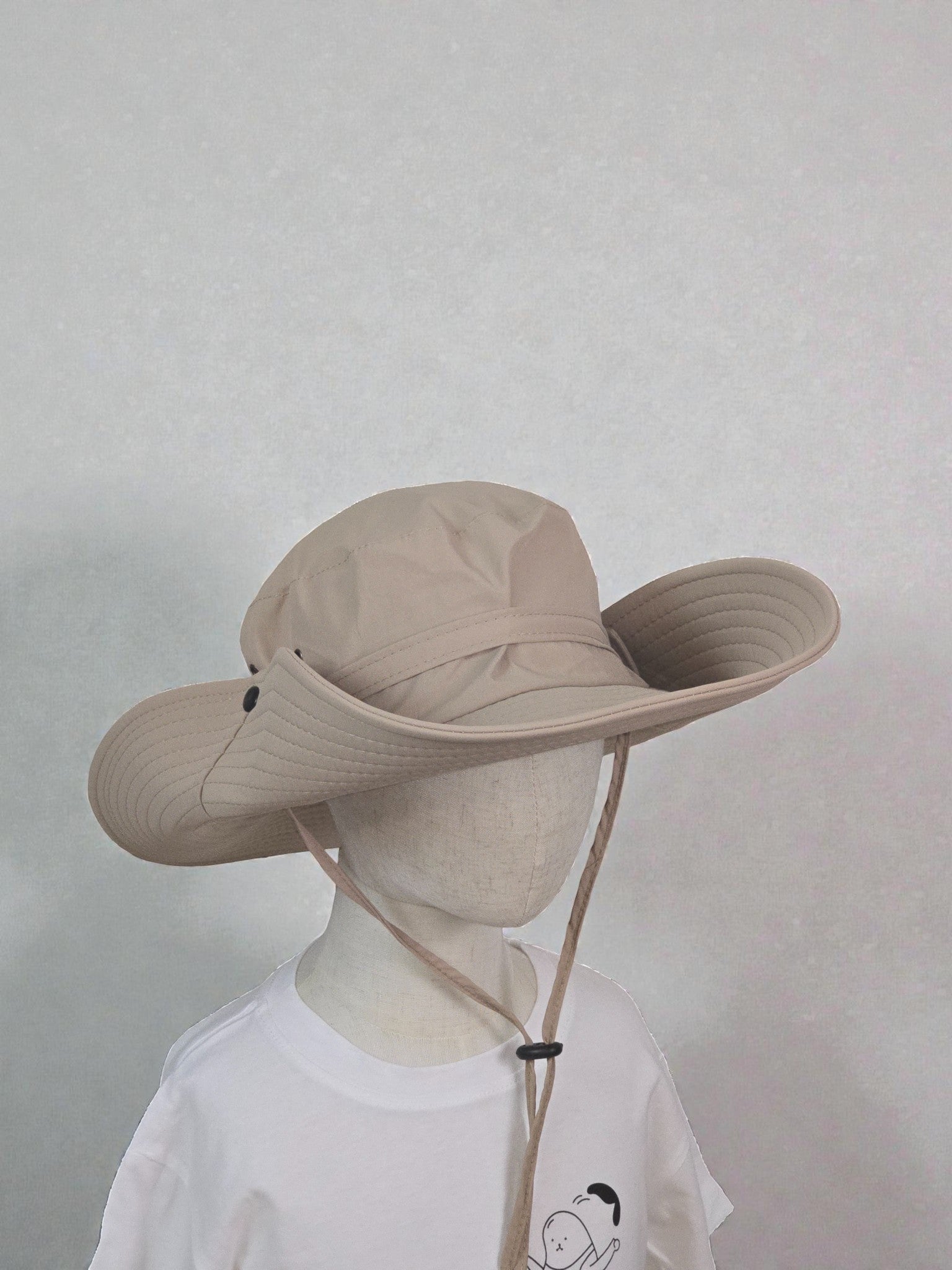 Kids Sun Outdoor Hat beige foldable wide-brimmed hat against a plain background