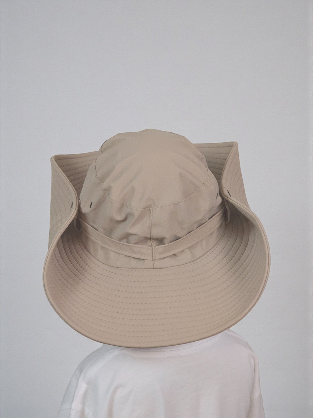 Kids Sun Outdoor Hat beige foldable wide-brimmed hat against a plain background