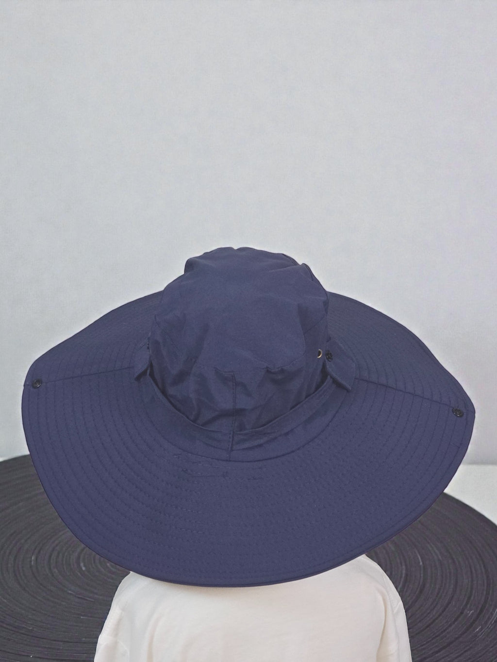 Kids Sun Outdoor Hat Navy foldable wide-brimmed hat against a plain background