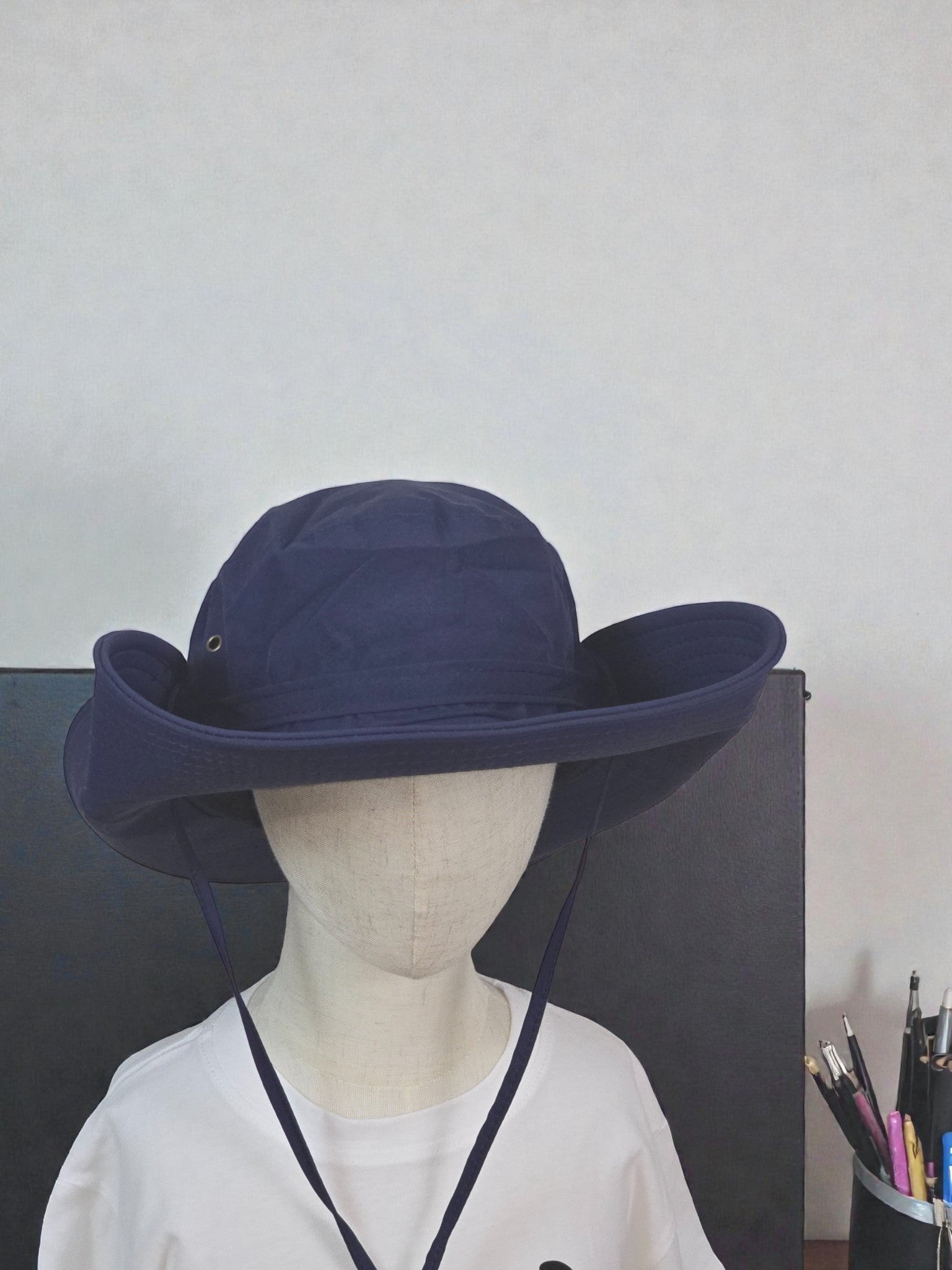 Kids Sun Outdoor Hat Navy foldable wide-brimmed hat against a plain background