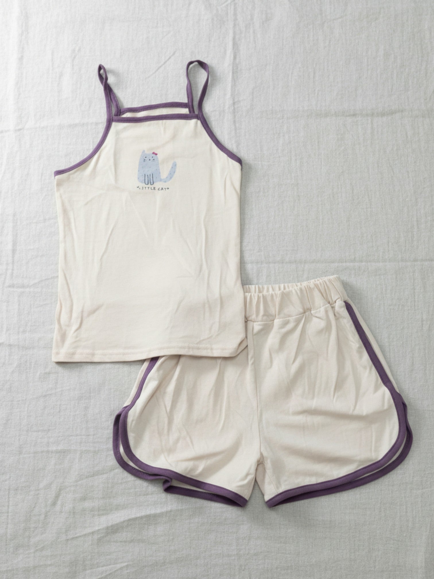 Kids cream camisole and shorts set with burgundy contrast trim and blue "Little Cat" graphic