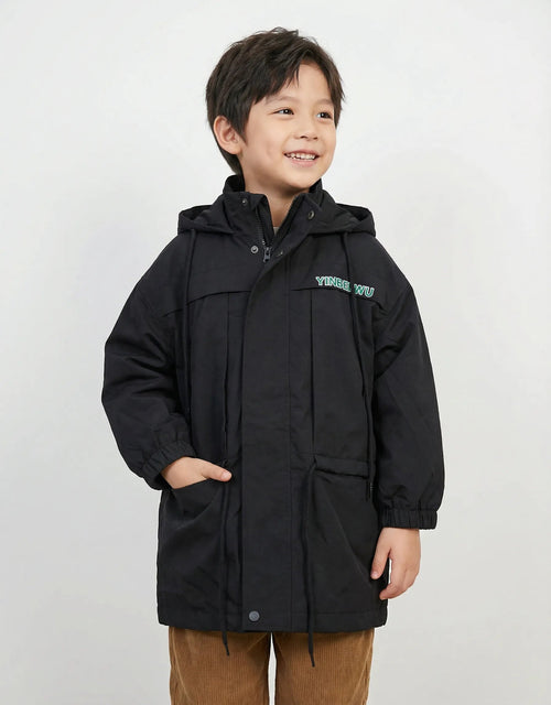 Kids black hooded parka jacket featuring a teal graphic on the chest, adjustable drawstrings, and elasticated cuffs on a light grey textured background