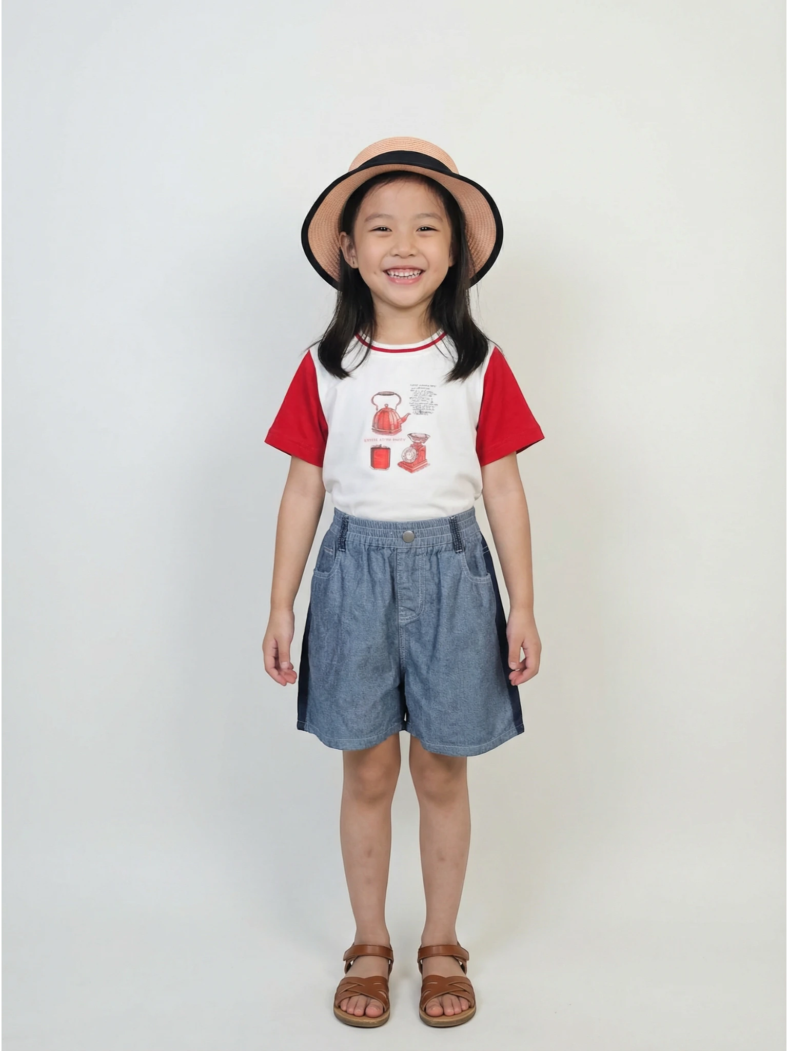 Kids blue denim shorts featuring bold white contrast stitching, a gathered elastic waistband, and a front metal button on a neutral grey background.