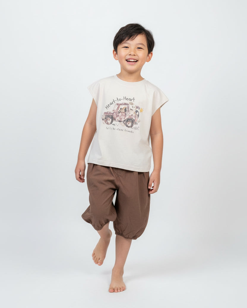 Kids wearing cream tee brown balloon pants comfortable casual outfit unisex children's clothing ages 2-10