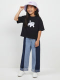 Kids blue denim jeans featuring a two-tone light and dark patchwork design, a gathered elastic waistband, and raw frayed hem
