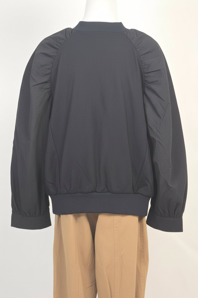 Durable and stylish black children's sweatshirt with elegant voluminous sleeves, designed for a high-end look with everyday playground comfort.