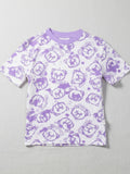 Purple t-shirt with teddy bear pattern on a gray background